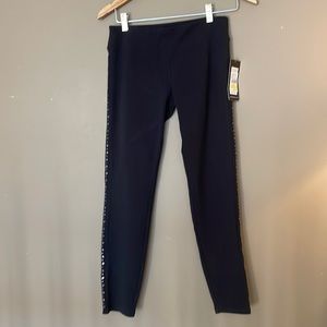 Black legging with silver studs going down side of pant Leg